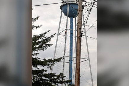 Police talk suicidal college student down from water tower
